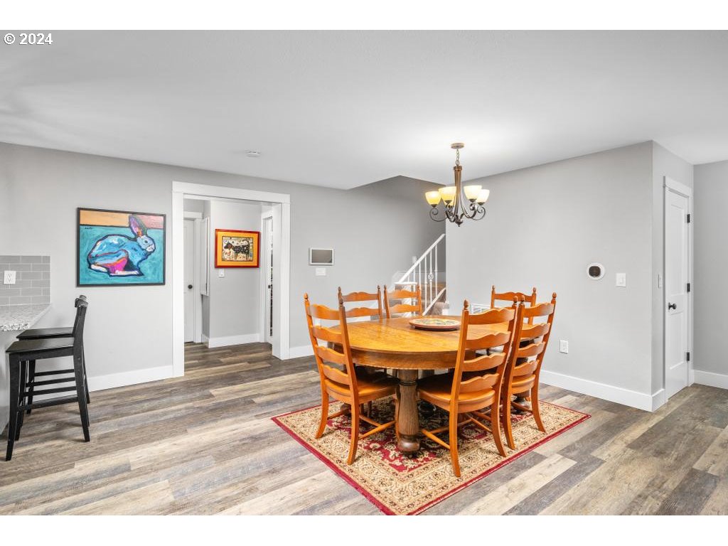 17762 South Redland Road Oregon City, OR 97045 - Photo 8 of 37 a dining room with furniture and wooden floor