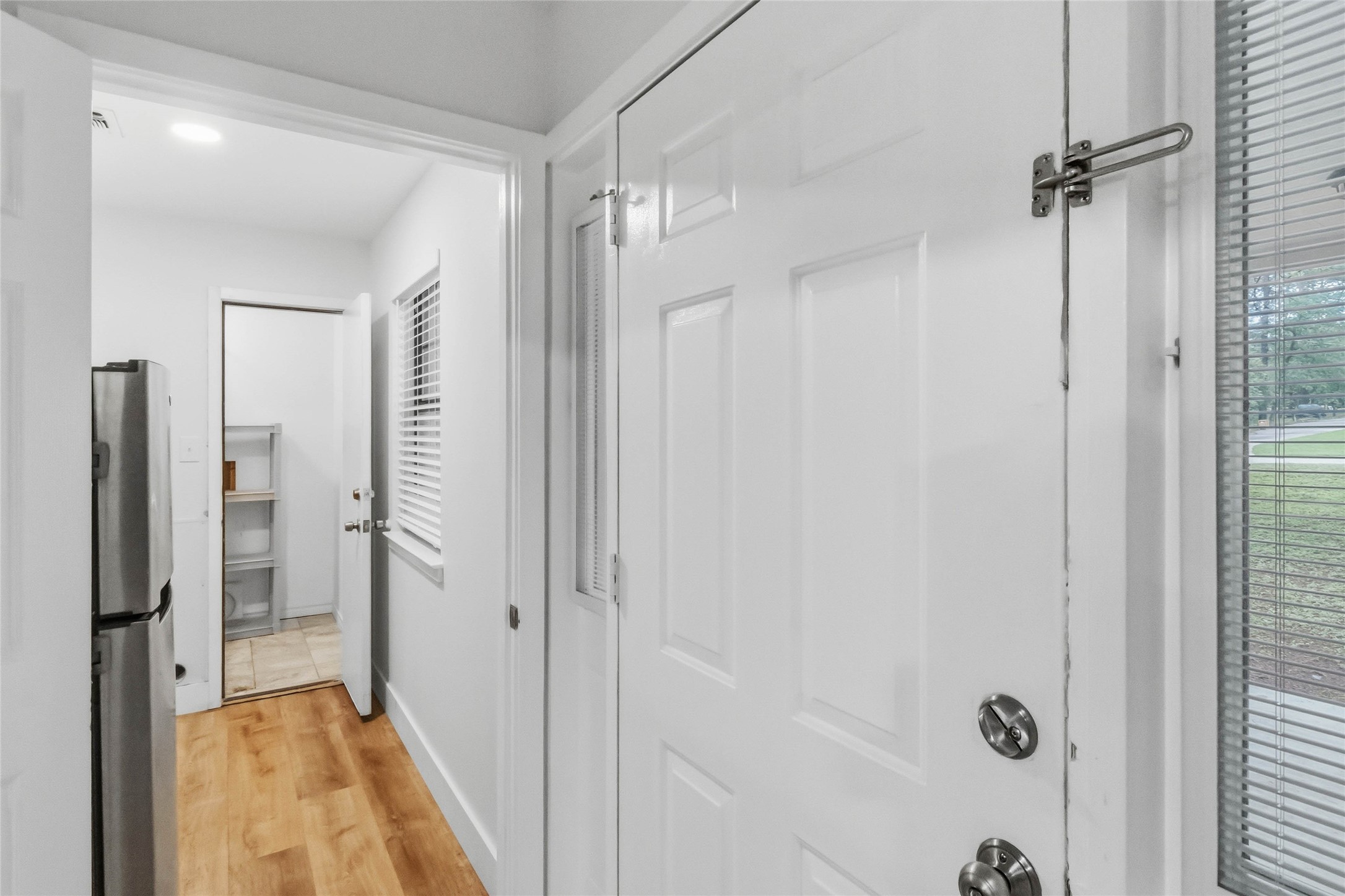 326 Pine View Loop Bastrop, TX 78602 - Photo 12 of 30 Enter into a light-filled corridor, offering practical utility and a welcoming threshold.