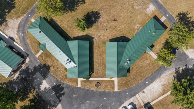 a front view of house with yard and swimming pool