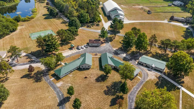 a kitchen with kitchen island a sink a counter and a refrigerator