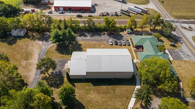 a living room with furniture flat screen tv and outdoor view