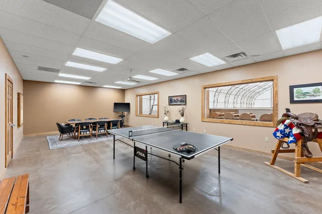 a room with furniture and gym equipment