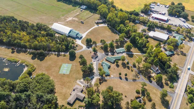 an aerial view of a house with a yard