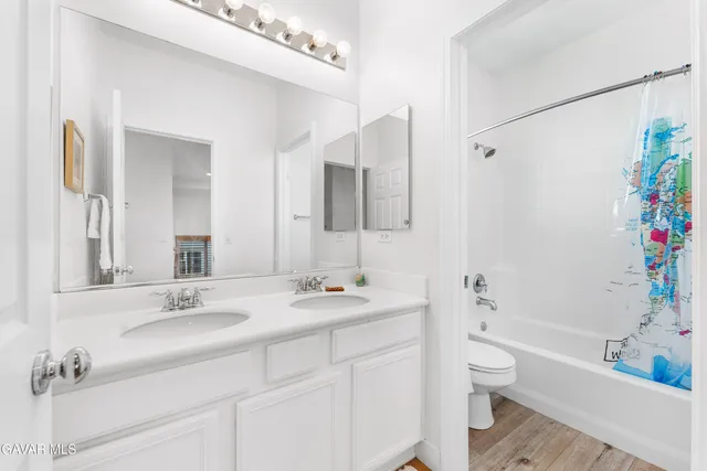 a bathroom with a sink a toilet and a bathtub