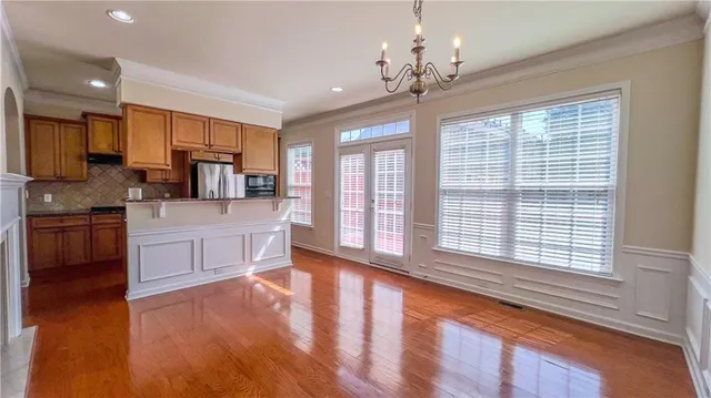 a kitchen with a stove a sink and a refrigerator