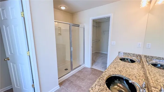 a bathroom with a bathtub and a shower