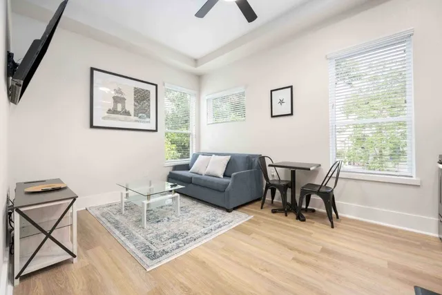a living room with furniture and a window