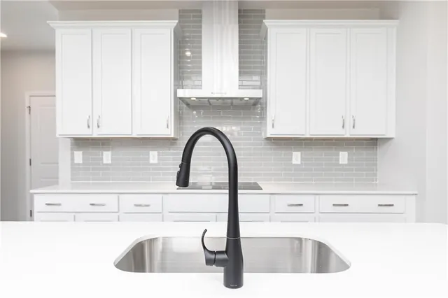 a kitchen with a sink and a microwave