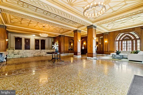 a view of a swimming pool with an outdoor seating