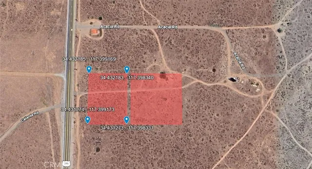 a view of an ocean beach and mountain