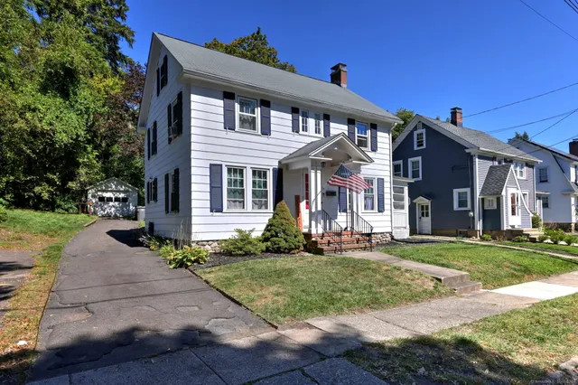 front view of a house with a yard