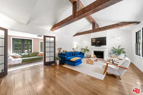 a living room with furniture fireplace and a flat screen tv