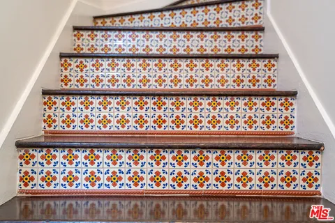 a view of a balcony with potted plants