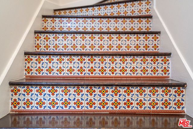 a view of a balcony with potted plants