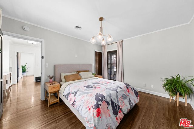 a living room with furniture and book shelf