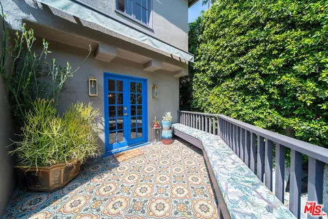 an aerial view of a house with a garden and plants