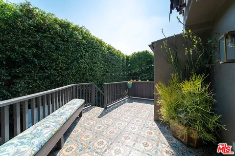 an aerial view of a house with a yard and garden