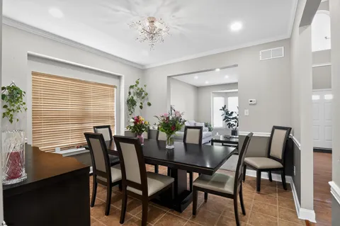 a view of a dining room with furniture and window