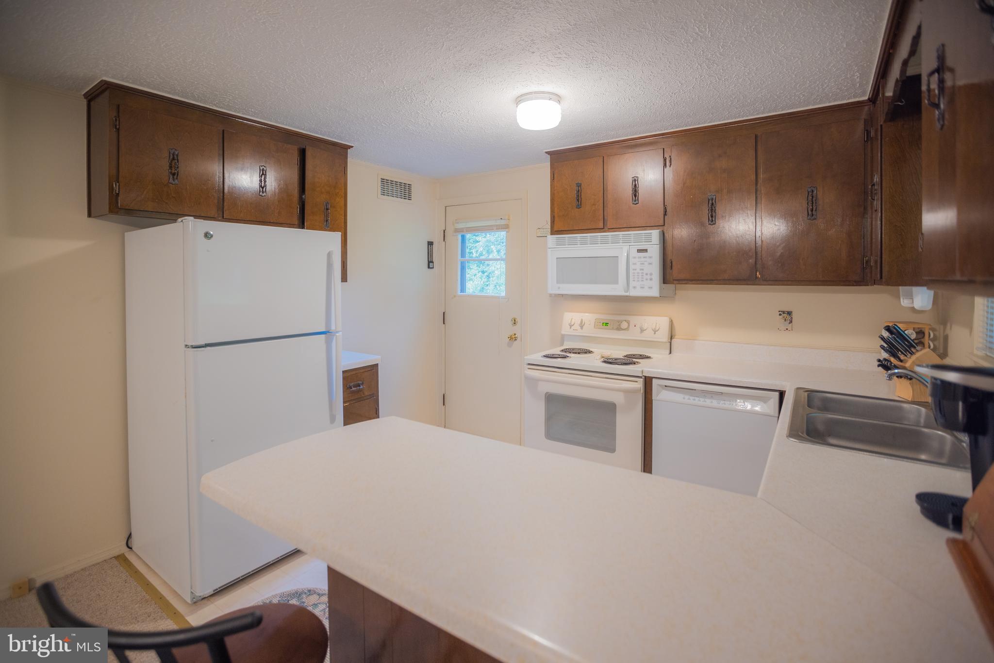7216 Sang Run Road McHenry, MD 21541 - Photo 11 of 40 Kitchen with outdoor exit to side of home.
