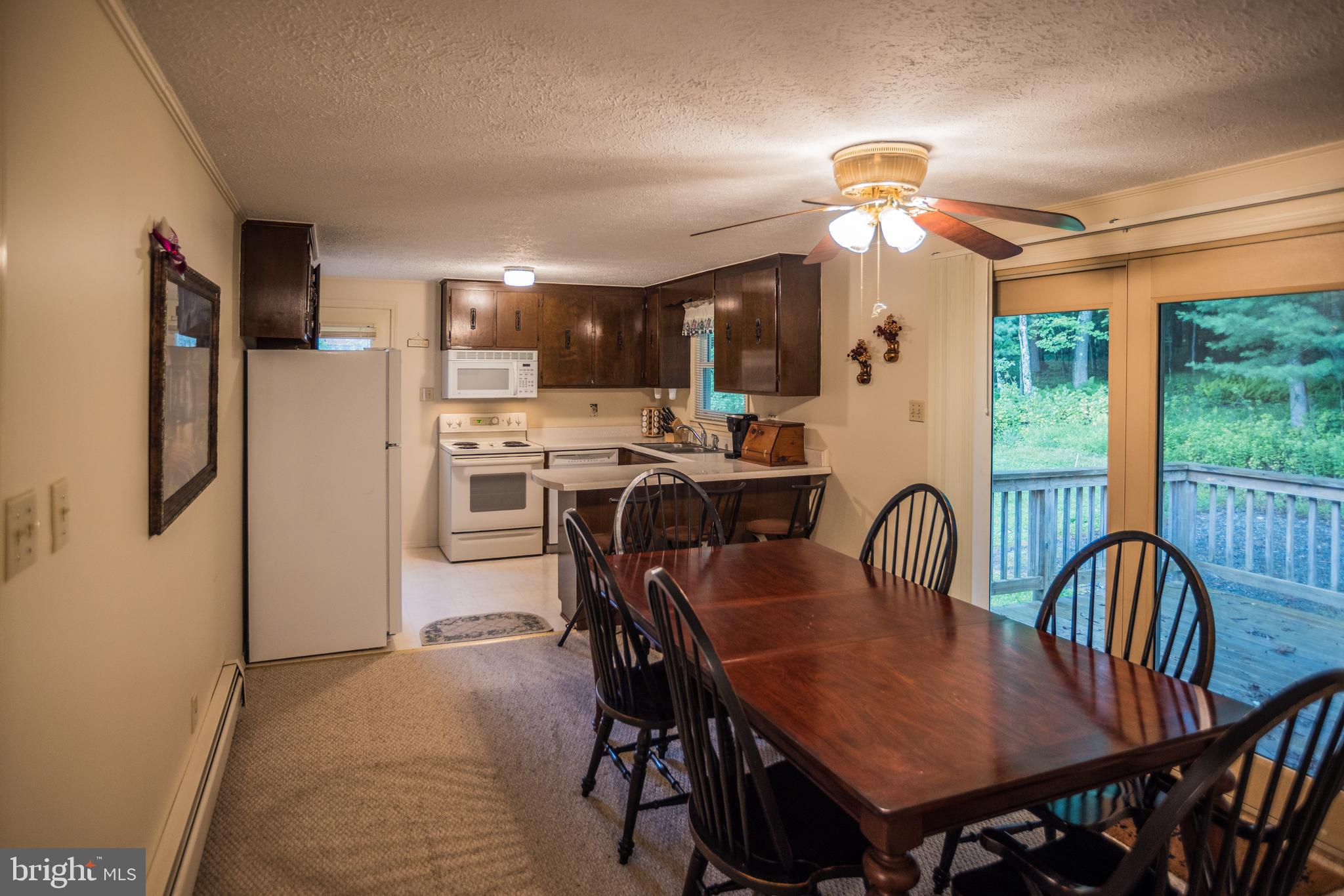 7216 Sang Run Road McHenry, MD 21541 - Photo 13 of 40 Dining room exiting to outdoor deck