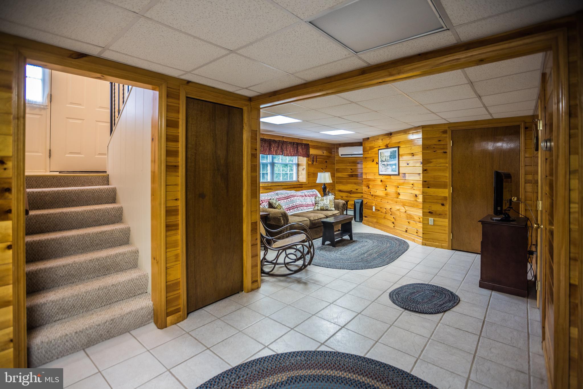 7216 Sang Run Road McHenry, MD 21541 - Photo 24 of 40 Downstairs living area with bunkbeds.