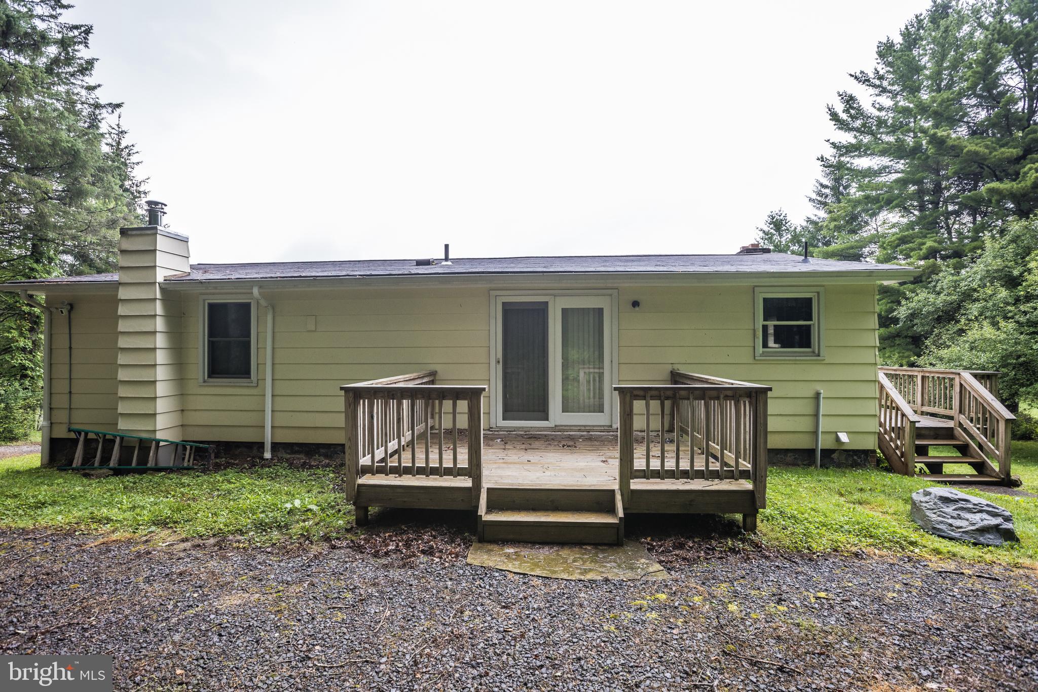 7216 Sang Run Road McHenry, MD 21541 - Photo 38 of 40 Gravel path to pull into the back yard and deck