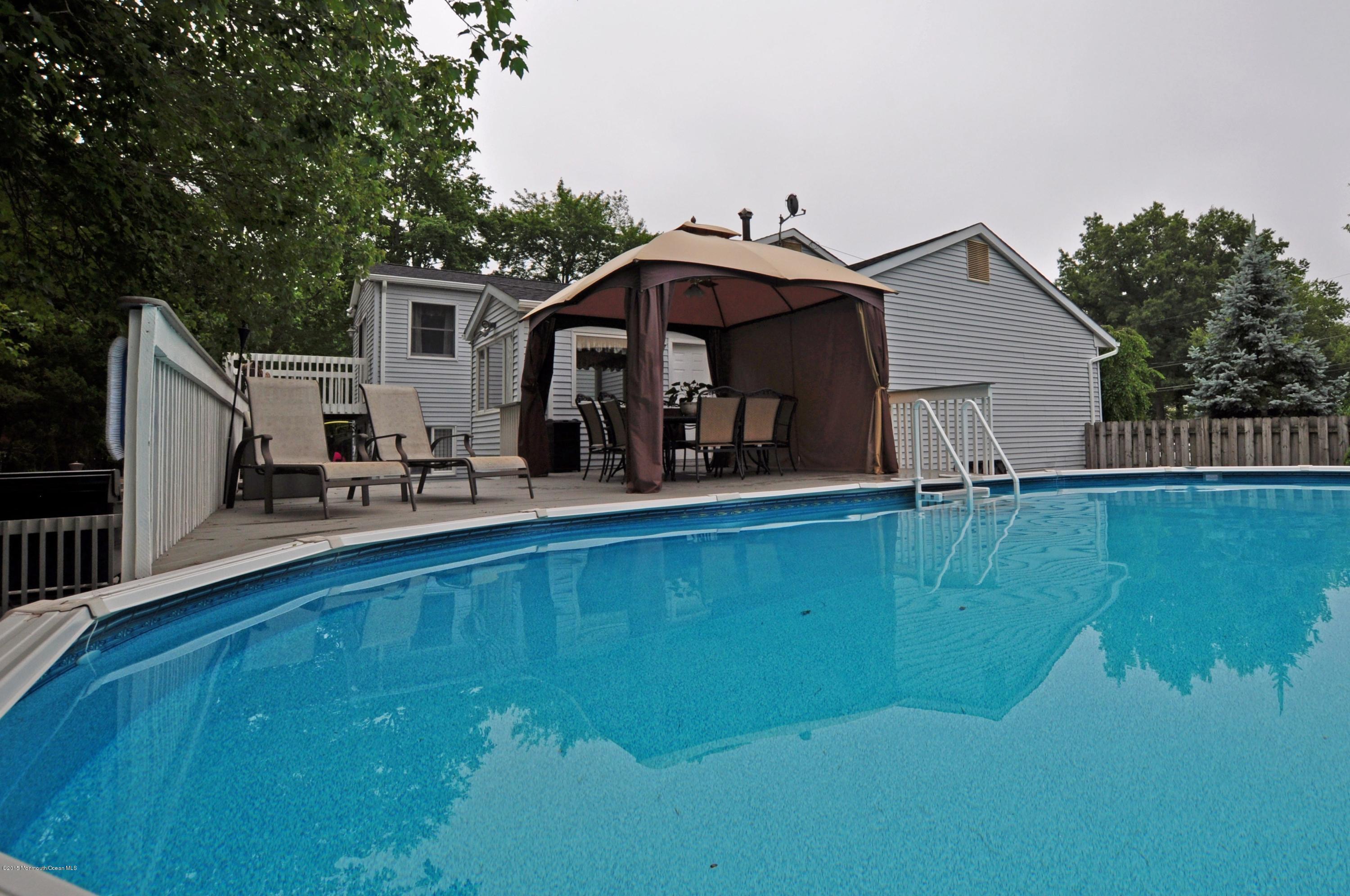 32 Chesapeake Road Manalapan, NJ 07726 - Photo 24 of 26 Side View with pool