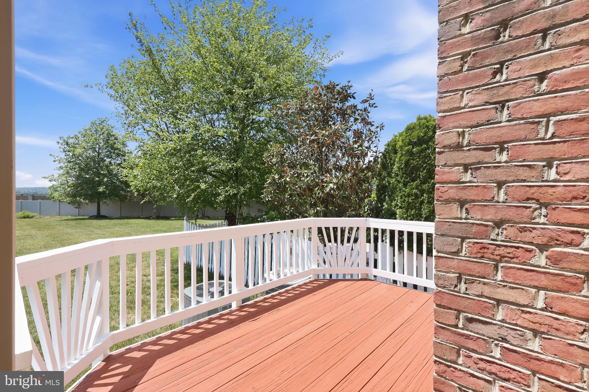 19617 Edgemont Square Ashburn, VA 20147 - Photo 53 of 65 a view of balcony with wooden floor and fence