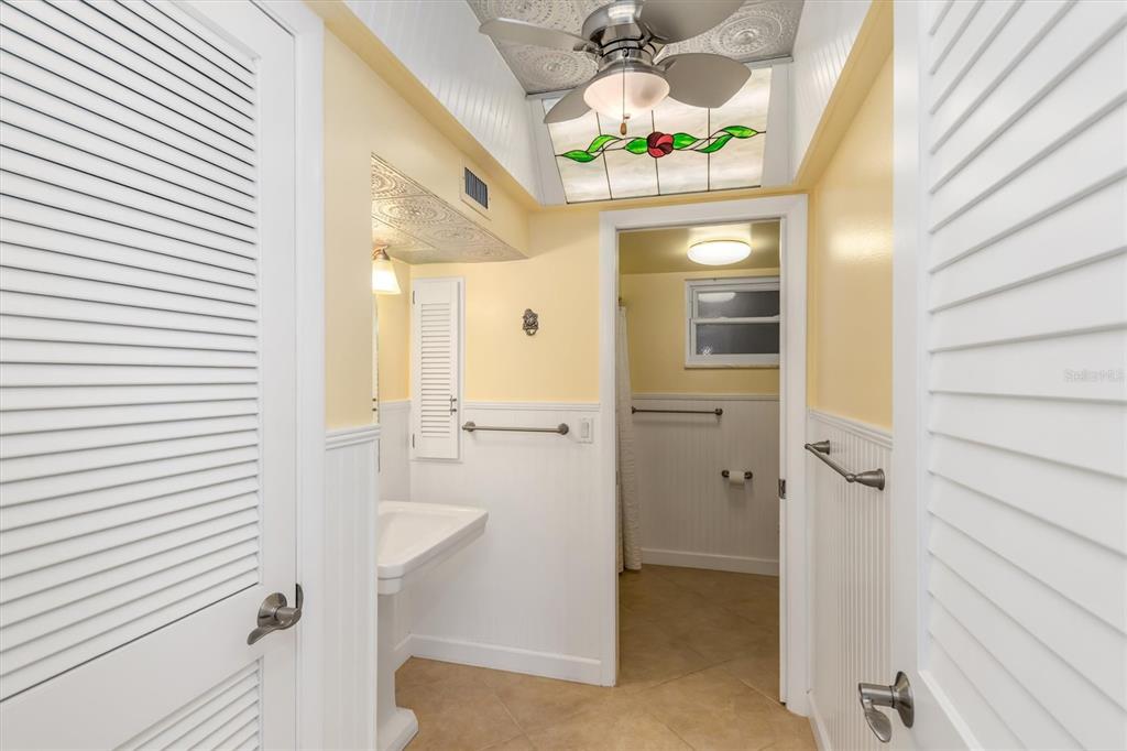 1 Colony Point Drive, Unit A8 Punta Gorda, FL 33950 - Photo 31 of 62 a bathroom with a sink and a mirror