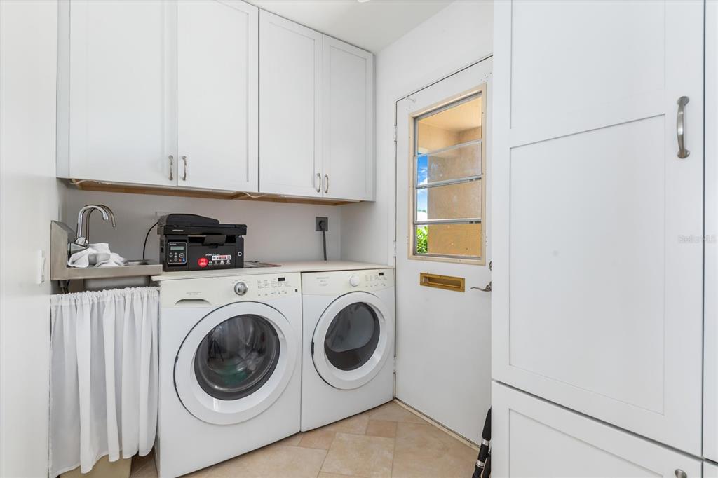 1 Colony Point Drive, Unit A8 Punta Gorda, FL 33950 - Photo 33 of 62 a utility room with dryer and washer
