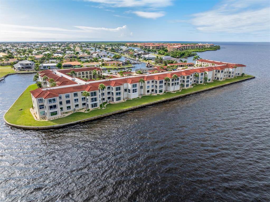 1 Colony Point Drive, Unit A8 Punta Gorda, FL 33950 - Photo 40 of 62 a view of a swimming pool and an outdoor space