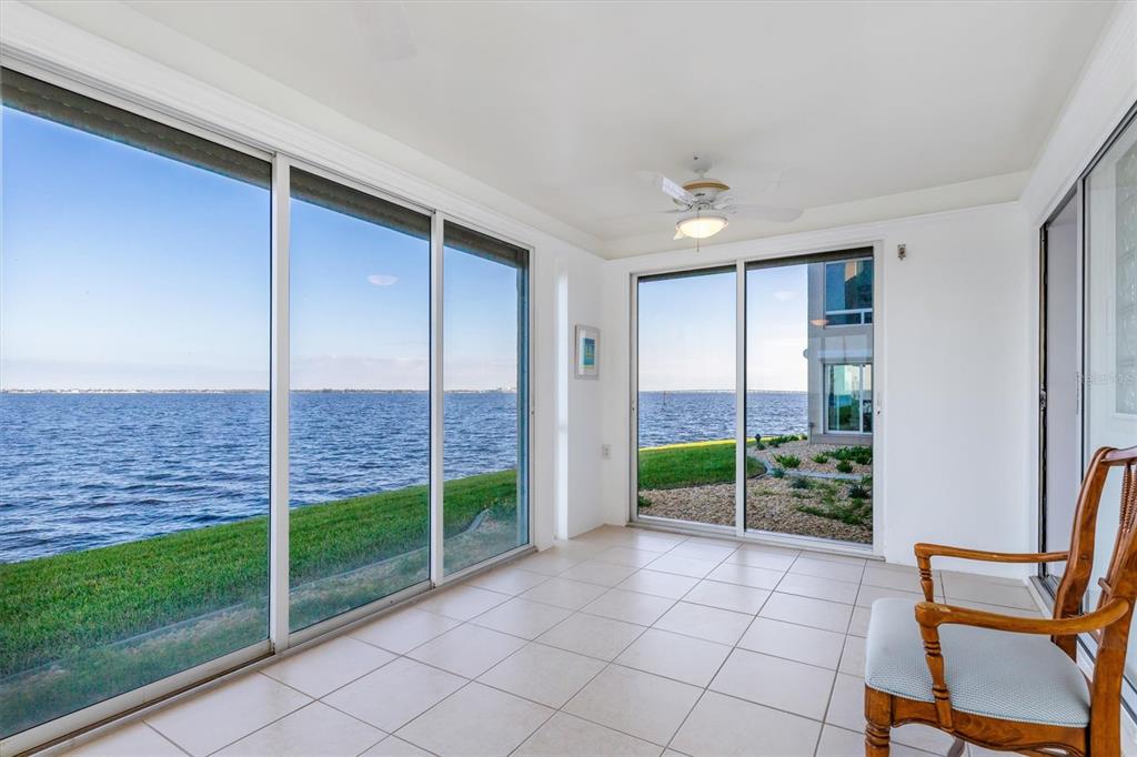 1 Colony Point Drive, Unit A8 Punta Gorda, FL 33950 - Photo 4 of 62 a view of an empty room with a balcony