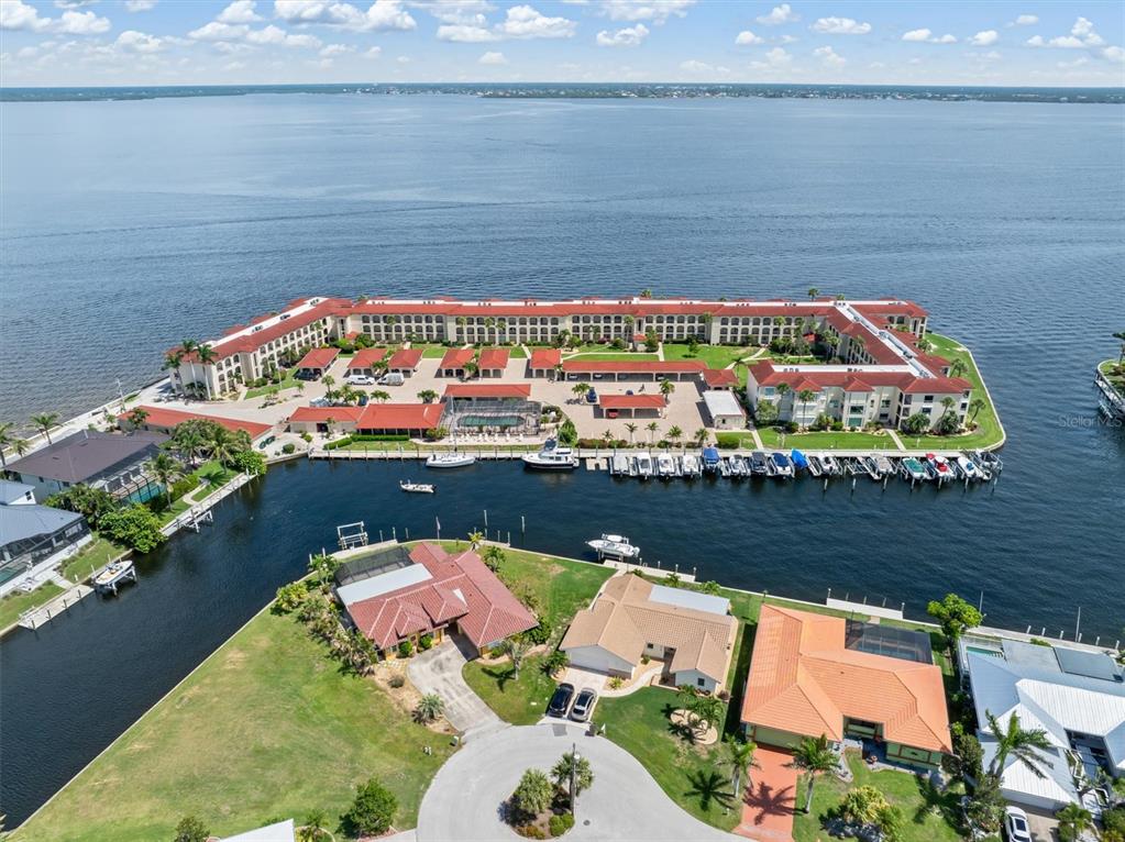 1 Colony Point Drive, Unit A8 Punta Gorda, FL 33950 - Photo 42 of 62 an aerial view of a house with a lake view