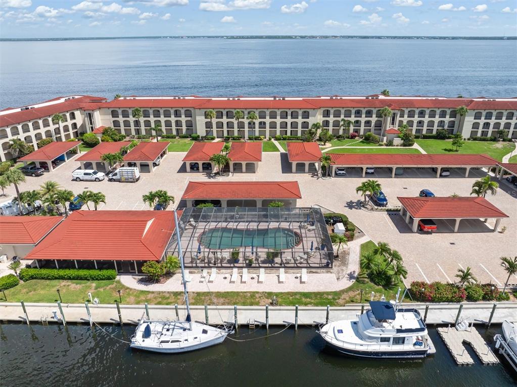 1 Colony Point Drive, Unit A8 Punta Gorda, FL 33950 - Photo 44 of 62 a view of swimming pool with outdoor seating