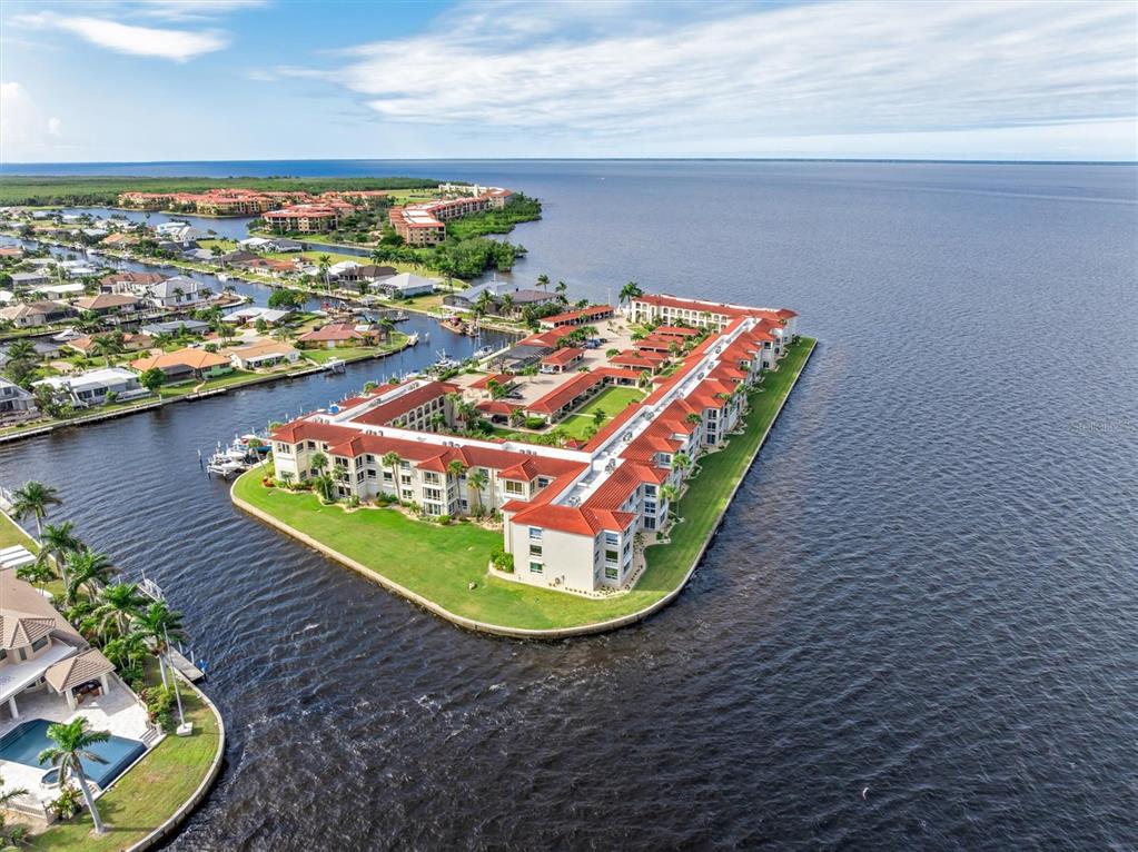 1 Colony Point Drive, Unit A8 Punta Gorda, FL 33950 - Photo 49 of 62 a view of a swimming pool with an outdoor space