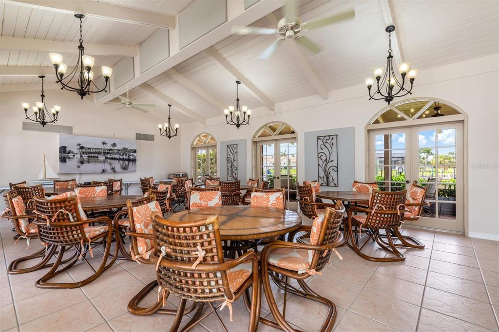 1 Colony Point Drive, Unit A8 Punta Gorda, FL 33950 - Photo 56 of 62 a view of a dining room with furniture window and outside view