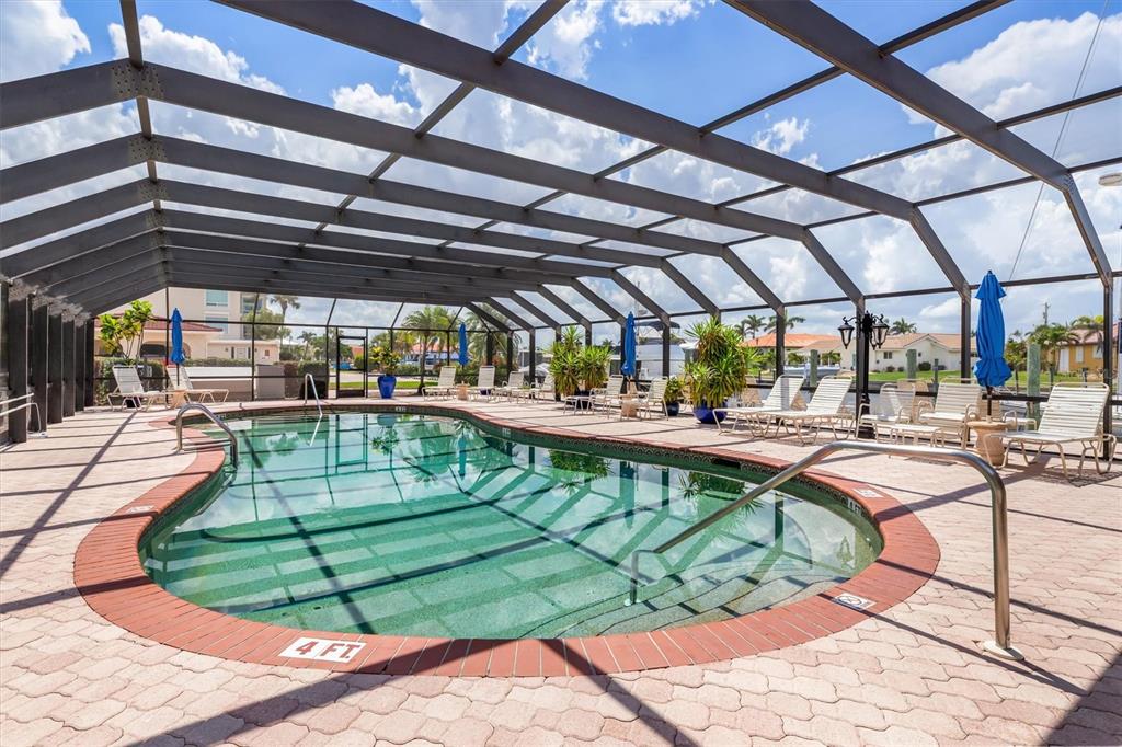 1 Colony Point Drive, Unit A8 Punta Gorda, FL 33950 - Photo 57 of 62 a view of a swimming pool with a patio