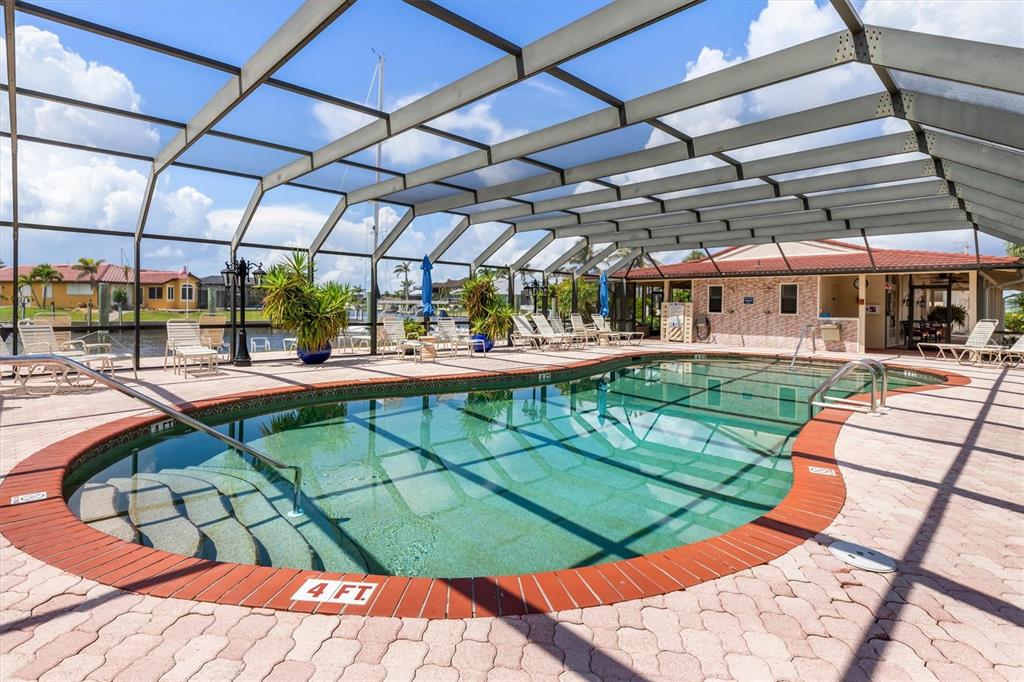 1 Colony Point Drive, Unit A8 Punta Gorda, FL 33950 - Photo 58 of 62 a view of a swimming pool with a patio