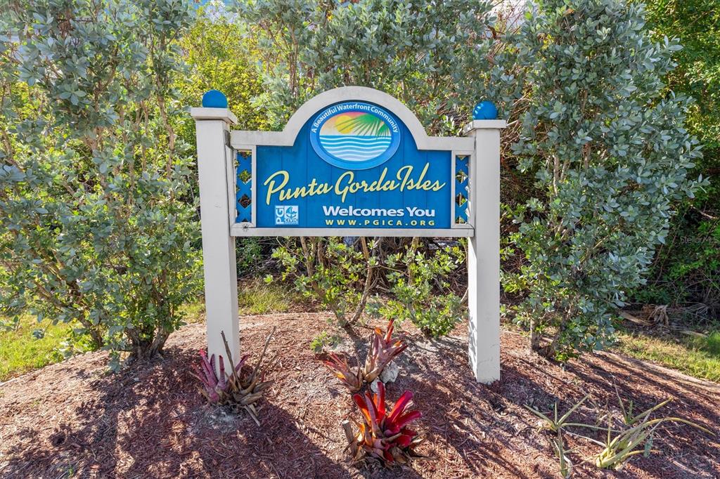 1 Colony Point Drive, Unit A8 Punta Gorda, FL 33950 - Photo 59 of 62 a sign on the side of a road
