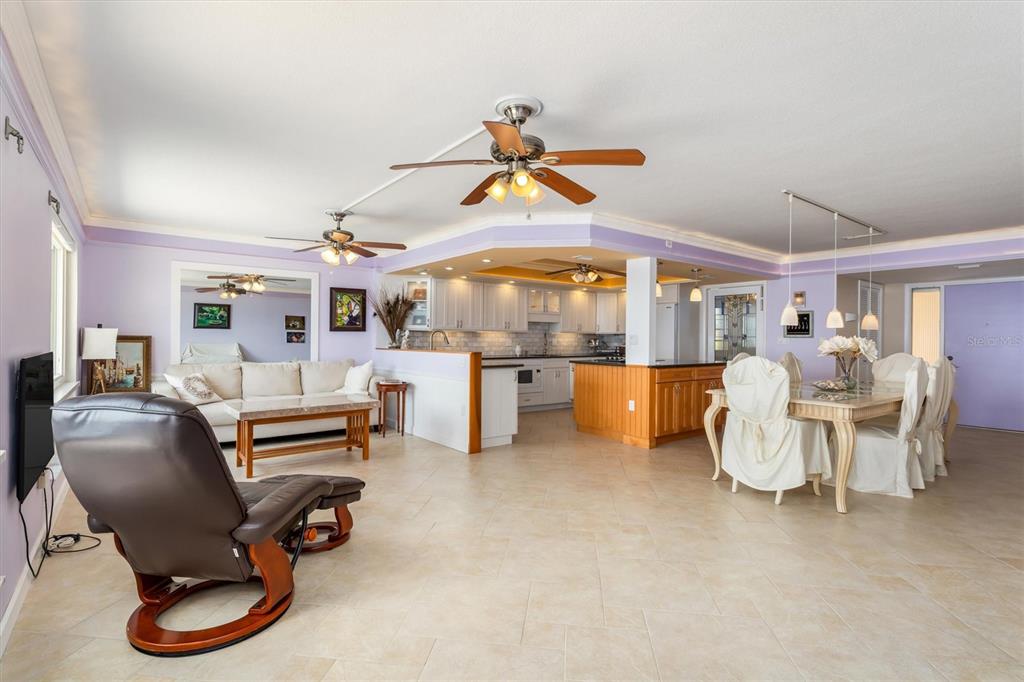 1 Colony Point Drive, Unit A8 Punta Gorda, FL 33950 - Photo 8 of 62 a living room with furniture and kitchen view