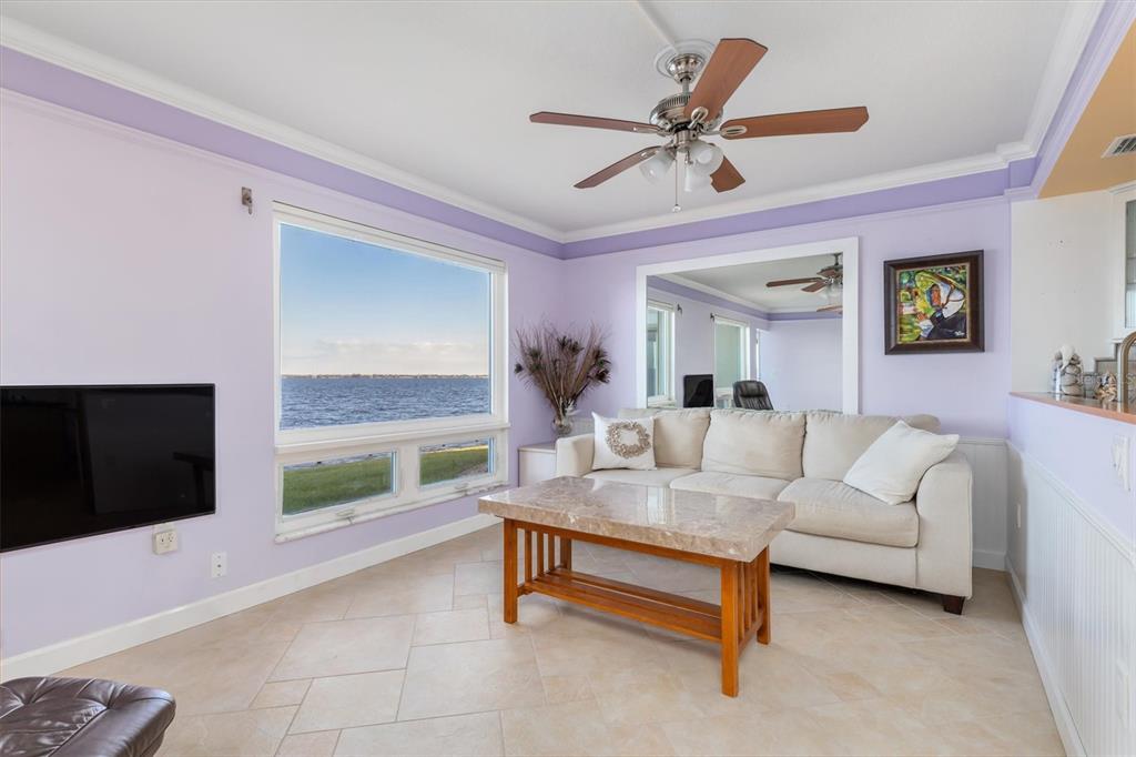 1 Colony Point Drive, Unit A8 Punta Gorda, FL 33950 - Photo 10 of 62 a living room with furniture and a flat screen tv