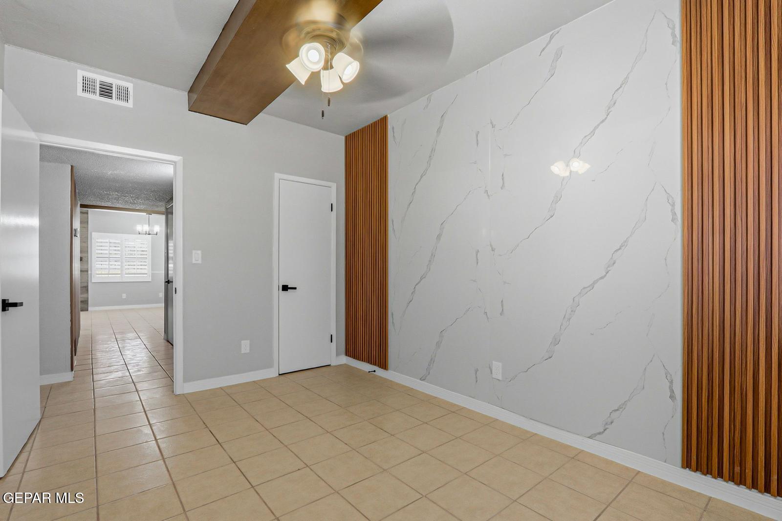 366 Riverside Drive Sunland Park, NM 88063 - Photo 11 of 34 a view of a hallway with wooden floor and a chandelier