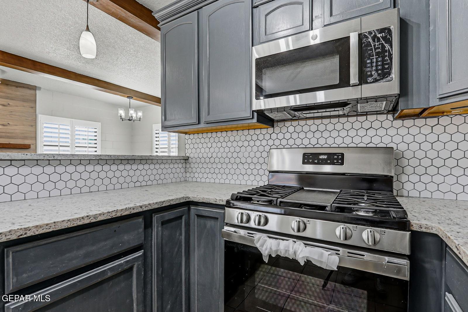 366 Riverside Drive Sunland Park, NM 88063 - Photo 27 of 34 a kitchen with stainless steel appliances a sink stove and cabinets
