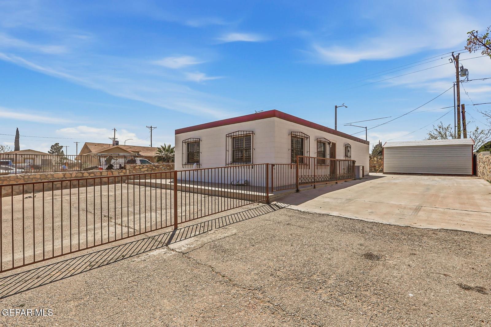 366 Riverside Drive Sunland Park, NM 88063 - Photo 32 of 34 a view of a house with a wooden fence