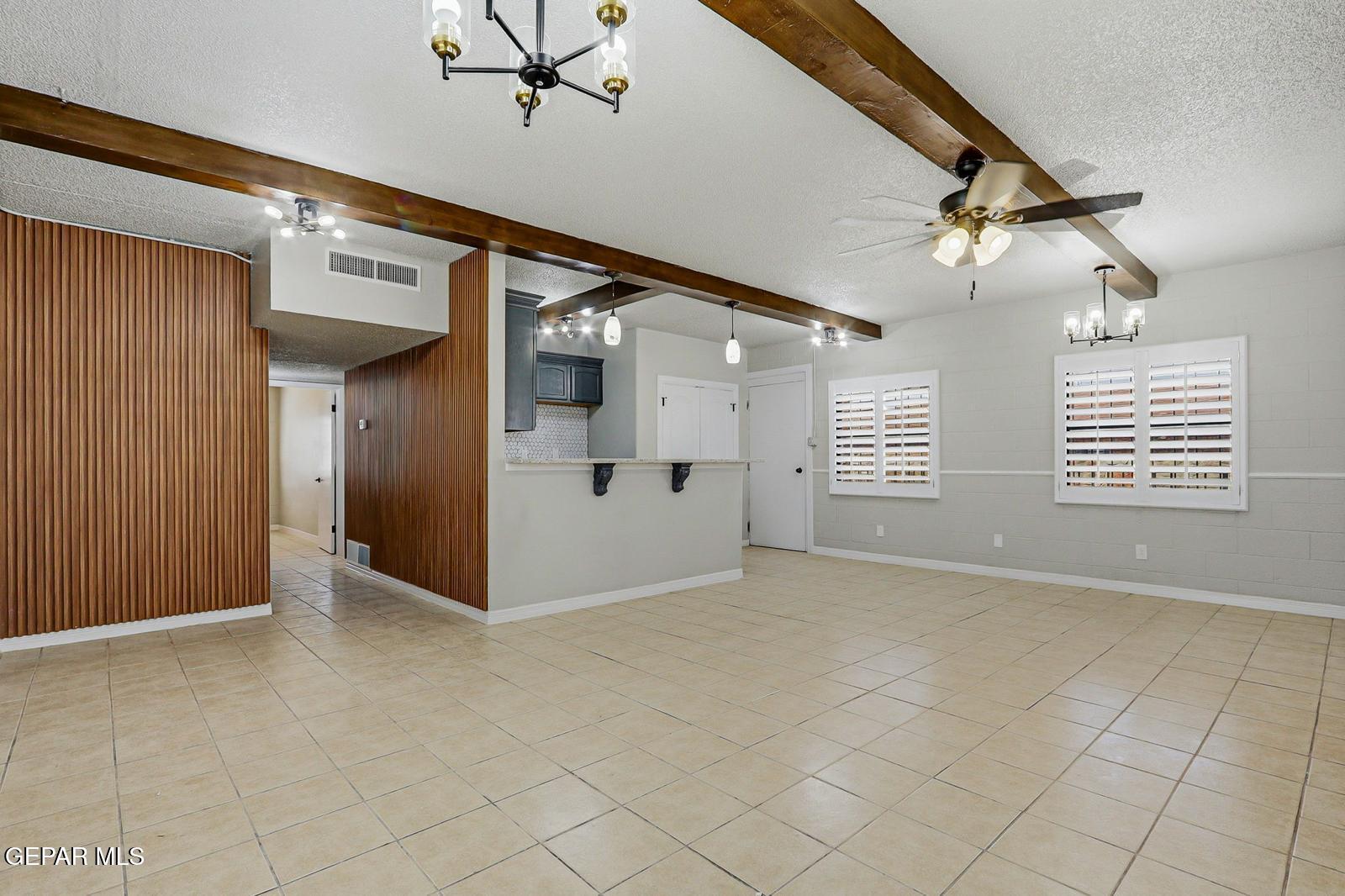 366 Riverside Drive Sunland Park, NM 88063 - Photo 5 of 34 an empty room with windows and fan