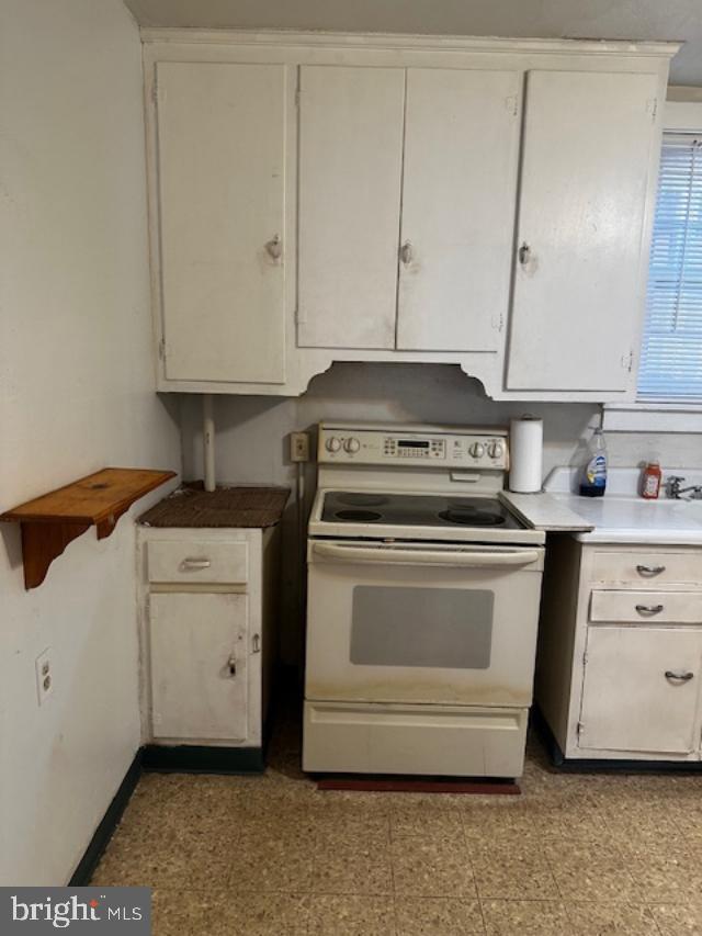 335 Chestnut Street Pottstown, PA 19464 - Photo 27 of 32 a kitchen with white cabinets and white appliances