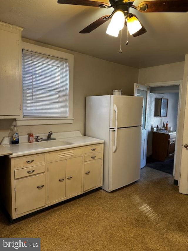 335 Chestnut Street Pottstown, PA 19464 - Photo 29 of 32 a kitchen with cabinets a refrigerator and a sink