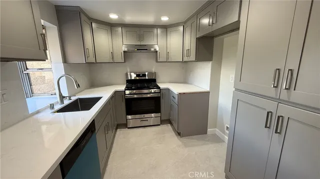 a kitchen with a sink and a window