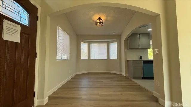 a view of kitchen with cabinets and wooden floor
