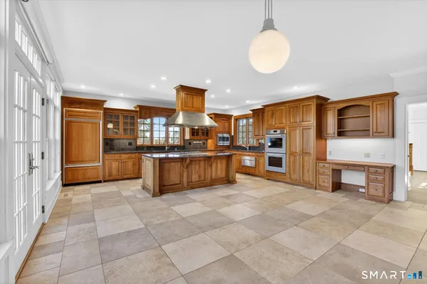 a kitchen that has a sink and cabinets